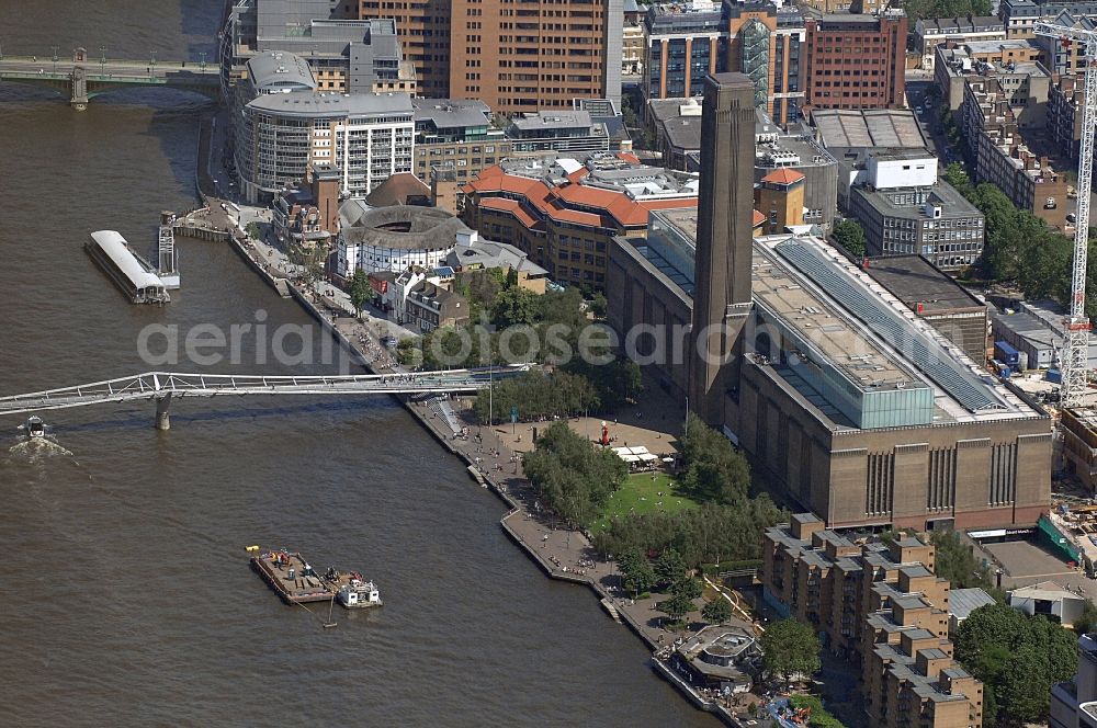 Aerial photograph London - Building of the Tate Gallery of Modern Art in the Borough of Southwark in London in the UK. The Tate Modern is the world's largest museum for modern art. It is located in a converted power station, the former Bankside Power Station, on the River Thames