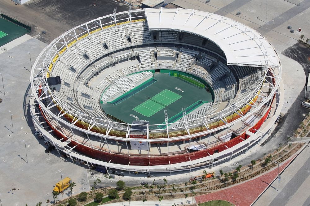 Rio de Janeiro from above - Building the tennis arena with green field in Barra Olympic Park before the summer playing games of XXII. Olympics in Rio de Janeiro in Rio de Janeiro, Brazil