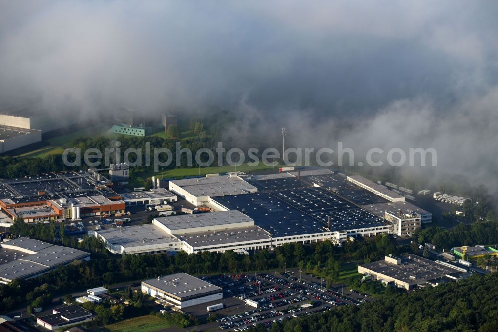 Melsungen from above - Building complex and grounds of the logistics center of EDEKA Handelsgesellschaft Hessenring GmbH Unter dem Schoeneberg in Melsungen in the state Hesse, Germany