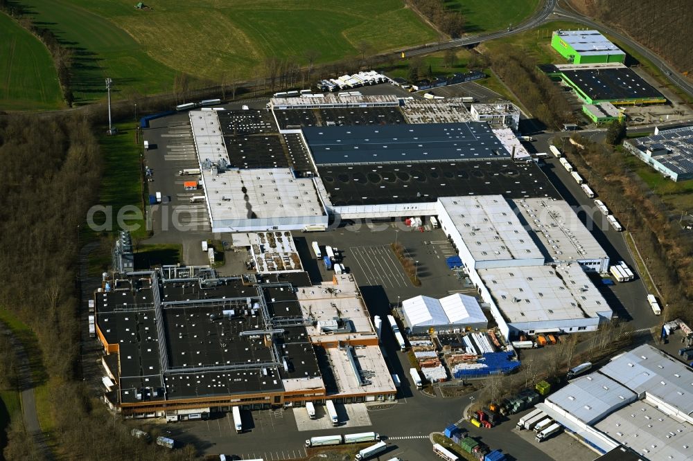 Melsungen from the bird's eye view: Building complex and grounds of the logistics center of EDEKA Handelsgesellschaft Hessenring GmbH Unter dem Schoeneberg in Melsungen in the state Hesse, Germany
