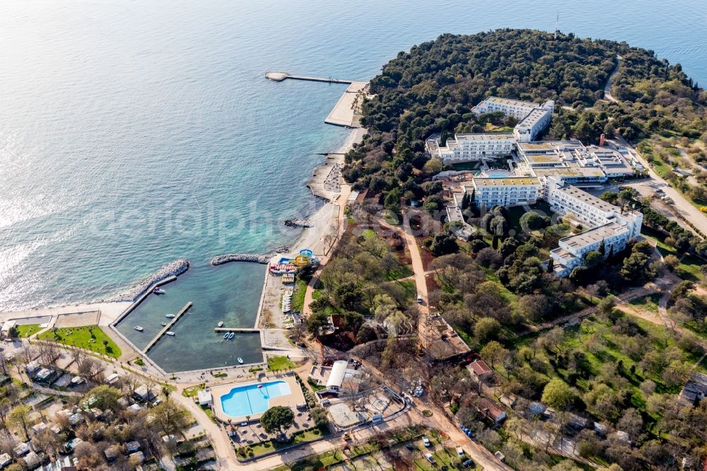 Aerial image Porec - Complex of the hotel building Hotel Delfin Plava Laguna on a half island in the adriatic sea in Porec in Istirien - Istarska zupanija, Croatia