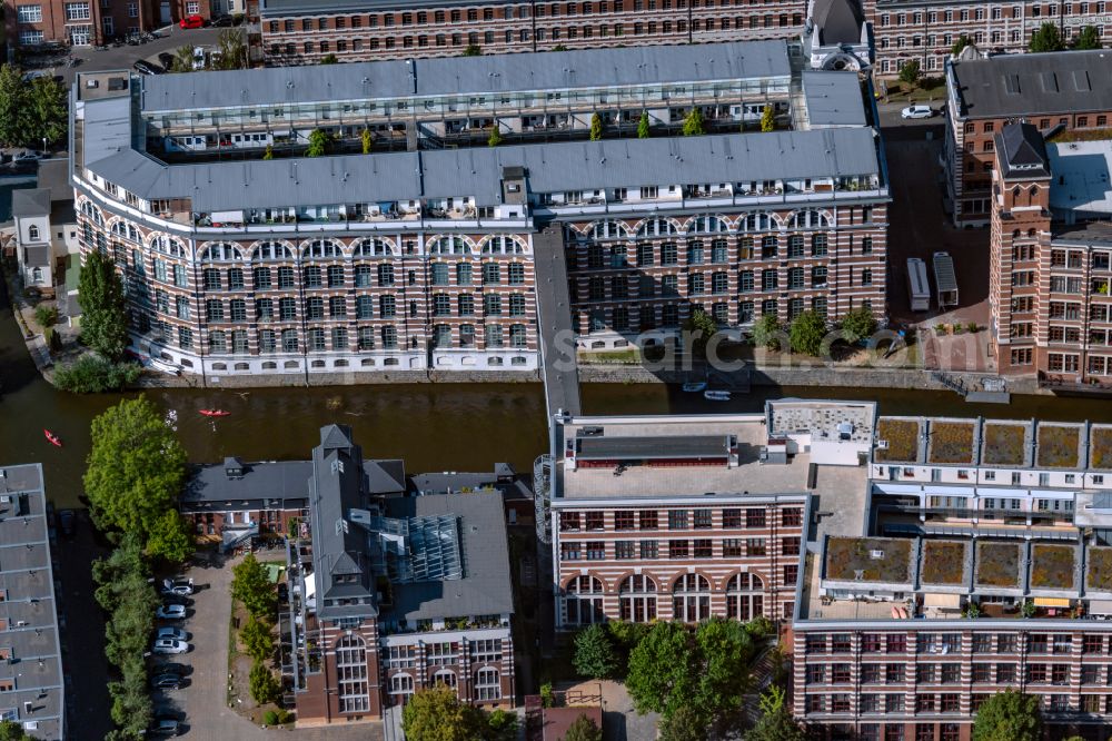 Aerial image Leipzig - Complex of the hotel building TRINOM Business Apartments, Elster Lofts in the office and commercial building district along the course of the Weisse Elster river on Nonnenstrasse in the district Plagwitz in Leipzig in the state Saxony
