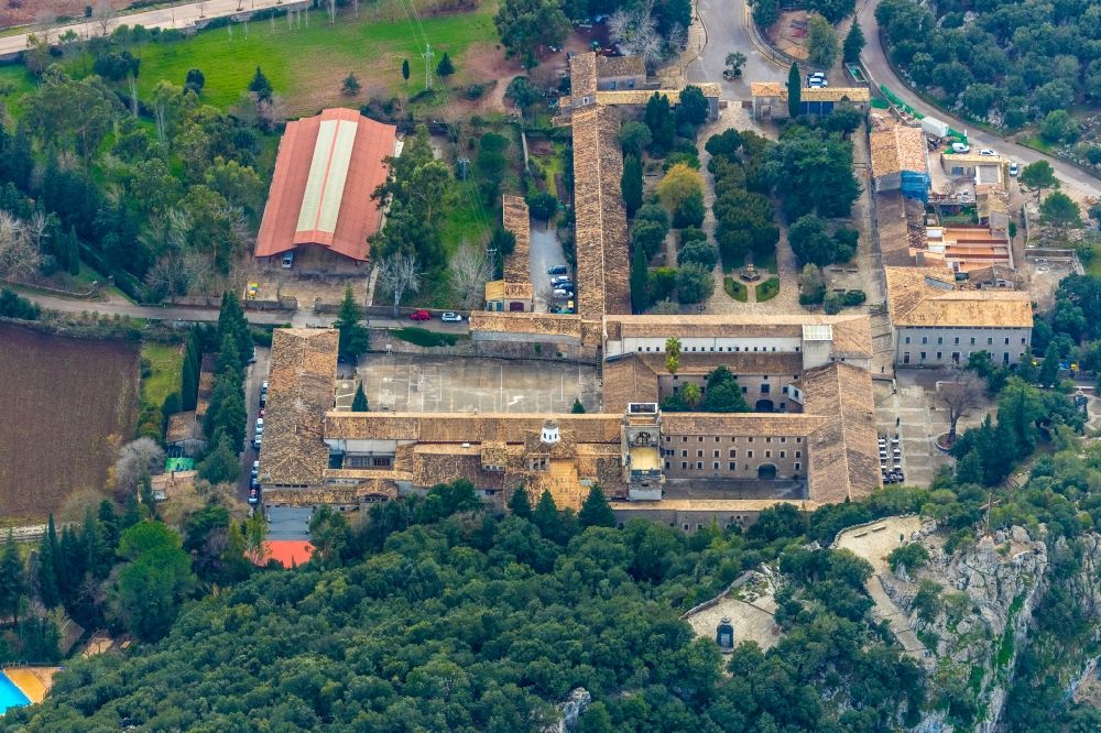 Aerial image Escorca - Complex of buildings of the monastery Santuari de Lluc in Escorca in Balearic island of Mallorca, Spain
