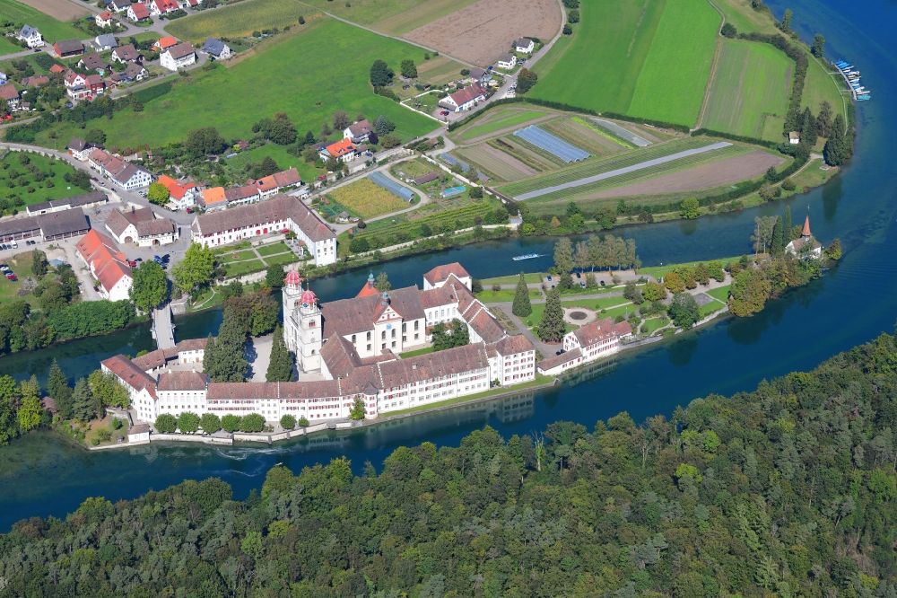 Rheinau from the bird's eye view: Complex of buildings of the monastery Rheinau at the river Rhine in Rheinau in the canton Zurich, Switzerland