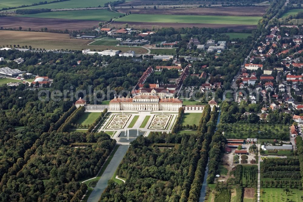 Oberschleißheim from the bird's eye view: New and old castle in the Schleissheim palace in the park of Schloss Oberschleissheim, courtyard garden with fountain and channel in Oberschleissheim in the state Bavaria The monumental new castle was built by Elector Max Emanuel, designed by Enrico Zuccalli from 1701. The Old Castle goes back to a house built under Duke Wilhelm mansion that was the center of the extensive Schwaighof and was called Wilhelmsbau