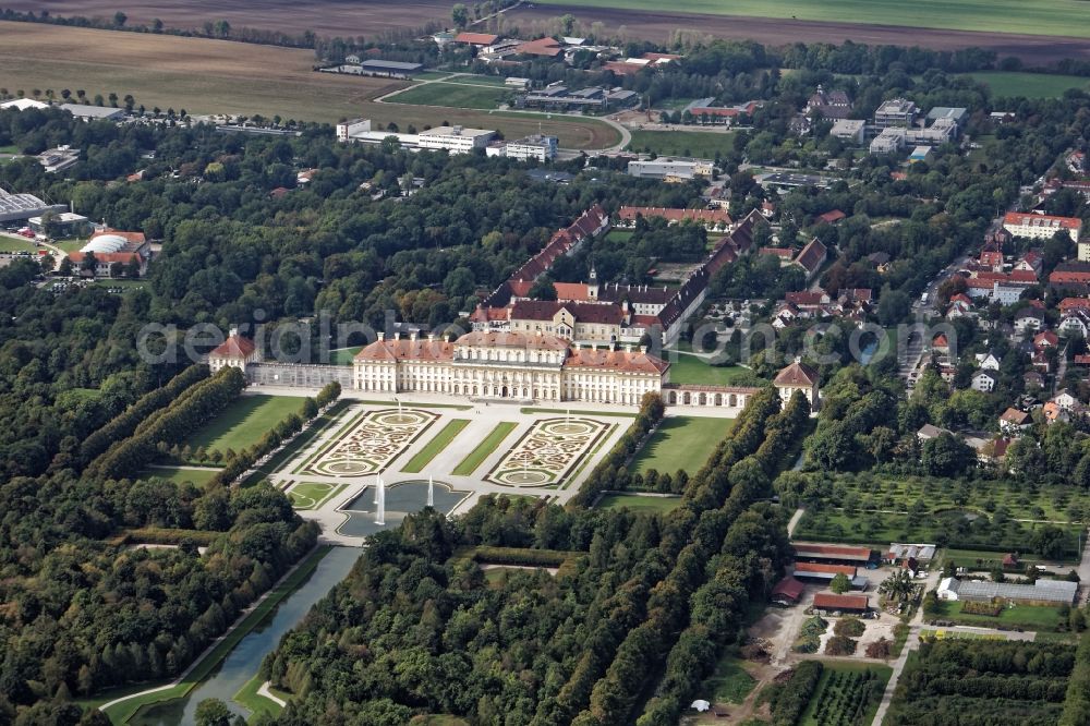 Oberschleißheim from above - New and old castle in the Schleissheim palace in the park of Schloss Oberschleissheim, courtyard garden with fountain and channel in Oberschleissheim in the state Bavaria The monumental new castle was built by Elector Max Emanuel, designed by Enrico Zuccalli from 1701. The Old Castle goes back to a house built under Duke Wilhelm mansion that was the center of the extensive Schwaighof and was called Wilhelmsbau