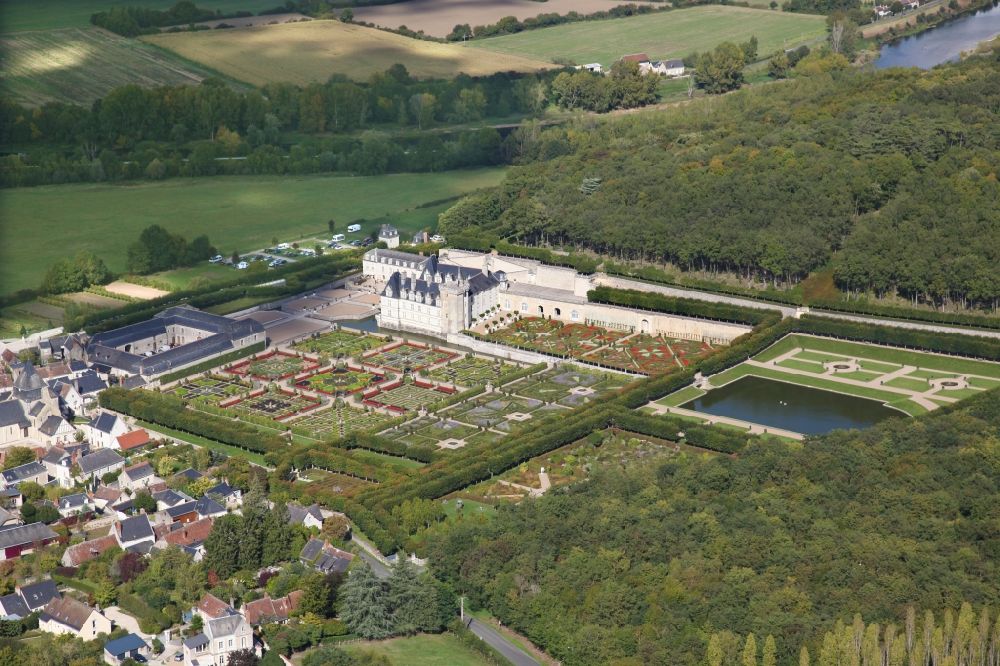Aerial image Villandry - Building complex in the park of the castle Chateau Villandry in Villandry in Centre-Val de Loire, France. The present castle was built by Jean Le Breton, finance minister under King Franz I, in the Renaissance style. The gardens, reconstructed according to old engravings, plans and gardens, are located on three levels: the sun garden, ornamental gardens with beech tree decorations, and a multi-colored kitchen garden consisting of nine squares