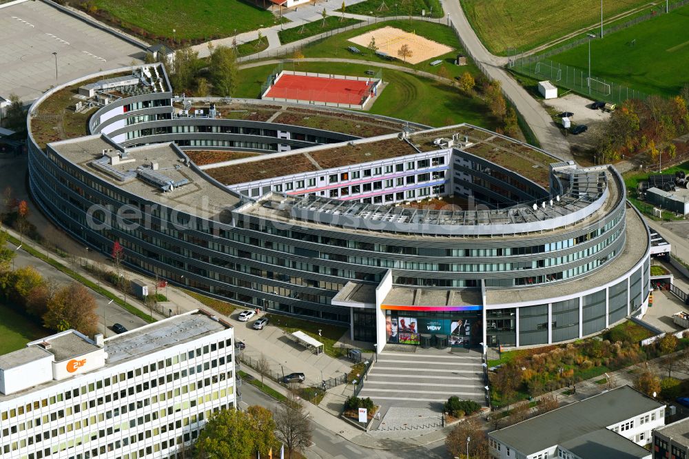 Unterföhring from the bird's eye view: Complex of buildings with satellite dishes on the transmitter broadcasting center Sky Media GmbH on Medienallee in Unterfoehring in the state Bavaria, Germany