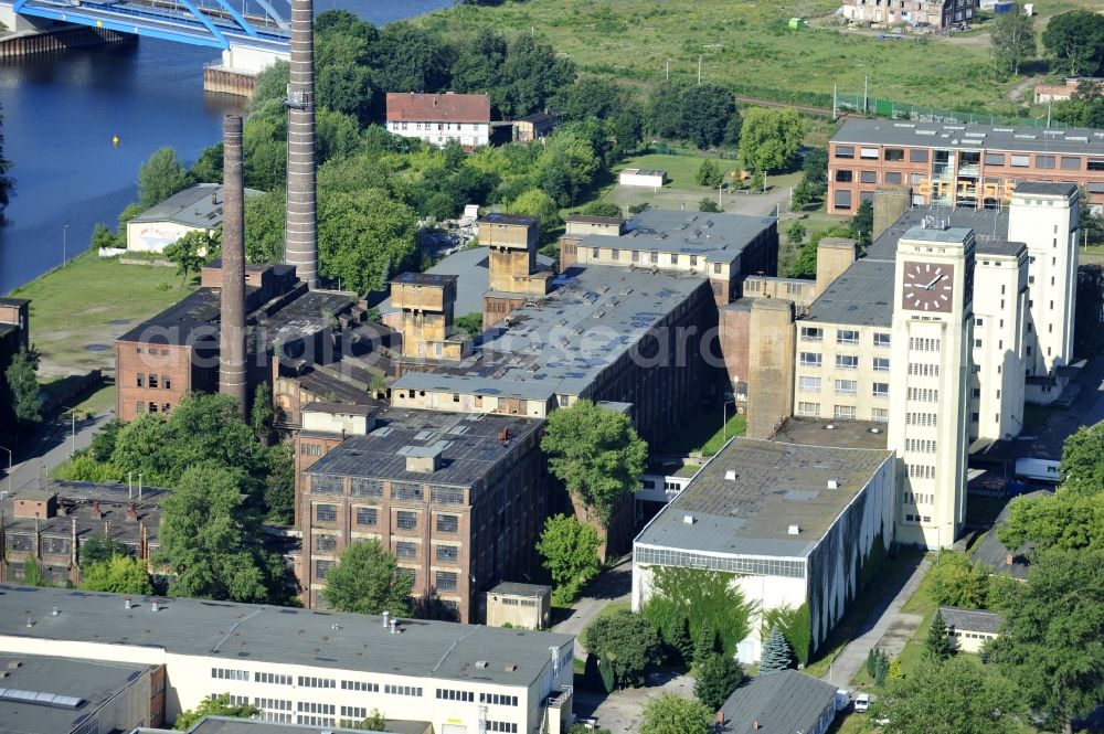 Wittenberge from the bird's eye view: View of the abandoned buildings of the former Veritas at the Bad Wilsnacker street in Wittenberg in the state of Brandenburg. After the dismantling of the singer-plant production under the name Veritas was continued. The clock tower of the former Singer sewing machine factory / Veritas in Wittenberg Germany is the largest and second largest clock tower in Europe