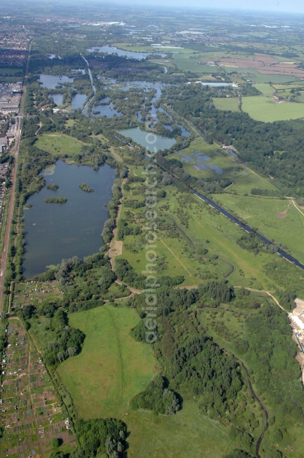 Aerial photograph Waltham Abbey - View at the flooded former gravel pits and the river Millhead Stream in Waltham Abbey Woods between Cheshunt and Waltham Abbey in the county of Essex in the UK. The floodplain area serves as a water reservoir and recreation area with a water sports school, the Herts Young Mariners Base. Among others, here in the Lee Valley Park, the Olympic events held in kayaking and canoeing