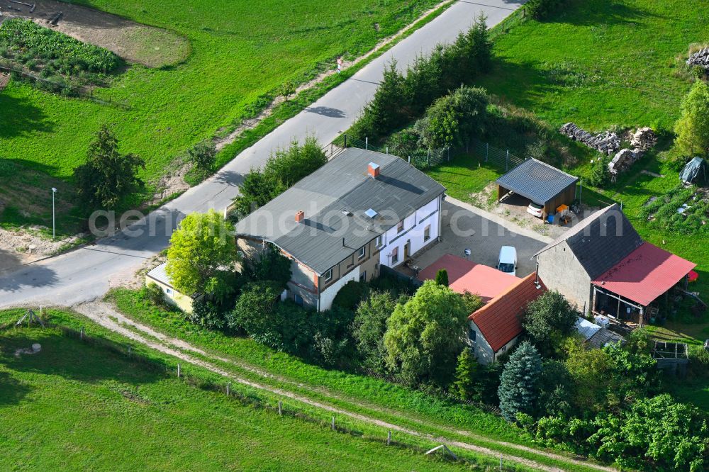 Woldegk from the bird's eye view: Homestead and farm outbuildings on the edge of agricultural fields on street Alte Landstrasse in Woldegk in the state Mecklenburg - Western Pomerania, Germany