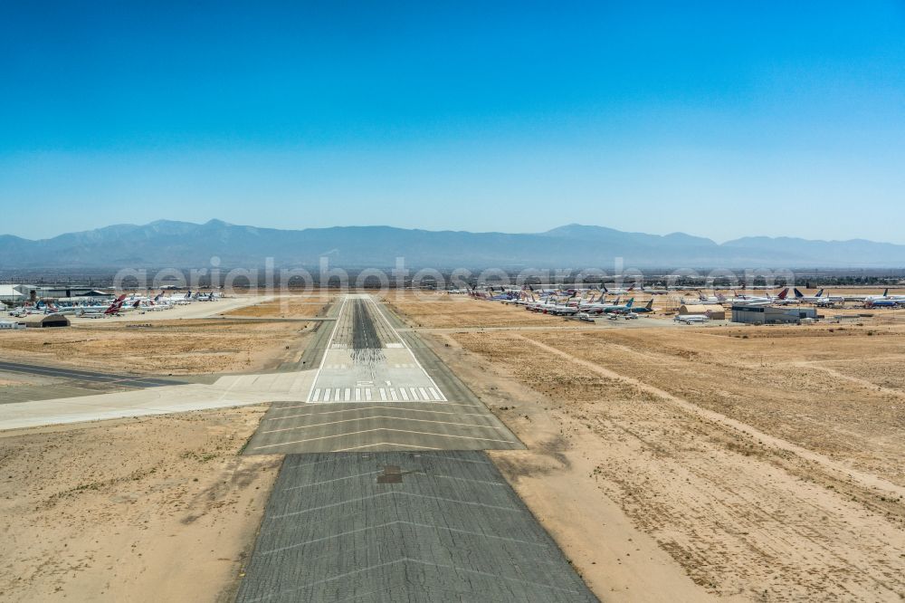 Victorville from above - Runway with hangar taxiways and terminals on the grounds of the airport Southern California Logistics Airport in Victorville in California, United States of America