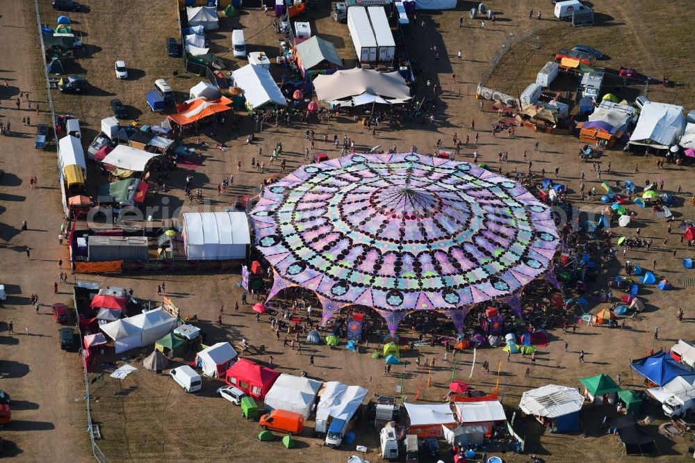 Stölln from above - Participants in the Antaris Projekt music festival on the event concert area on airfield in Stoelln in the state Brandenburg, Germany