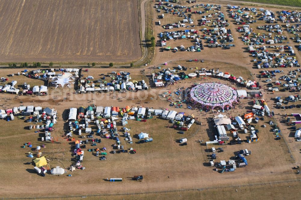 Stölln from above - Participants in the Antaris Projekt music festival on the event concert area on airfield in Stoelln in the state Brandenburg, Germany