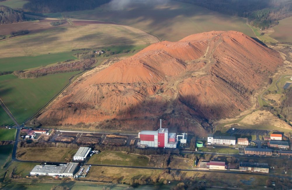 Holungen from the bird's eye view: Site of the mining stockpile for potash and salt production Schacht Bischofferode in Holungen in the state Thuringia, Germany