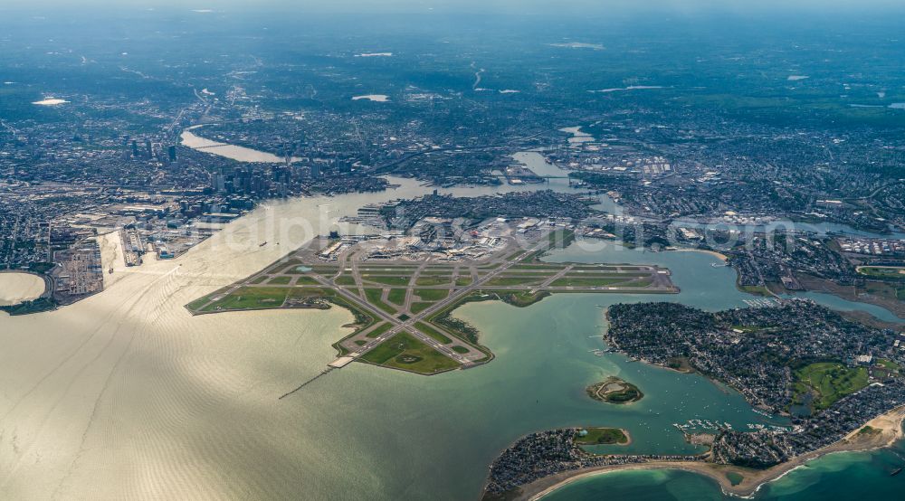 Boston from the bird's eye view: Runway with hangar taxiways and terminals on the grounds of the airport Boston Logan International Airport in Boston in Massachusetts, United States of America