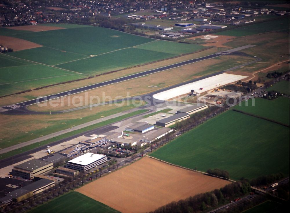 Dortmund from the bird's eye view: Runway with hangar taxiways and terminals on the grounds of the airport in Dortmund in the state North Rhine-Westphalia, Germany