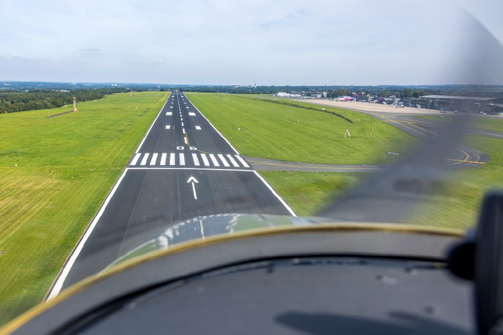 Dortmund from the bird's eye view: Runway with hangar taxiways and terminals on the grounds of the airport in Dortmund at Ruhrgebiet in the state North Rhine-Westphalia, Germany