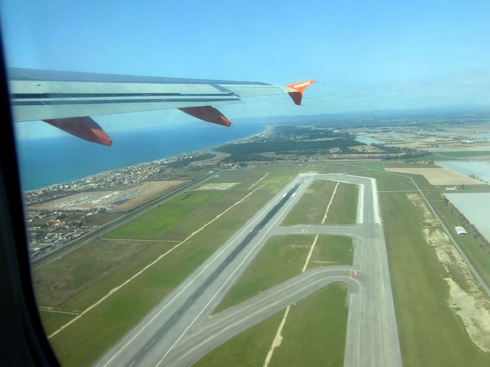 Fiumicino from the bird's eye view: Runway with taxiways on the grounds of the airport Leonardo da Vinci-Fiumicino Airport in Fiumicino at the Mediterranean Sea in Lazio, Italy