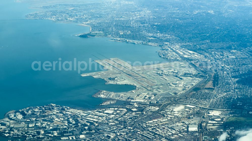 Aerial photograph South San Francisco - Runway with hangar taxiways and terminals on the grounds of the airport San Francisco International Airport in South San Francisco in California, United States of America