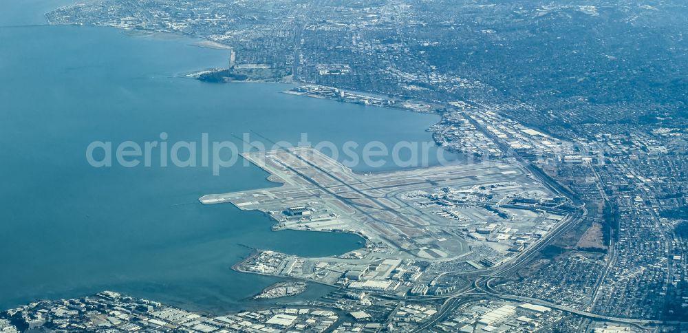 South San Francisco from above - Runway with hangar taxiways and terminals on the grounds of the airport San Francisco International Airport in South San Francisco in California, United States of America