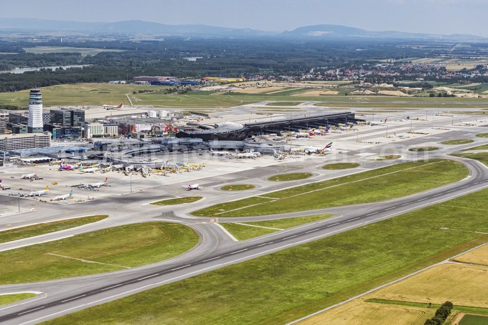 Schwechat from the bird's eye view: Runway with hangar taxiways and terminals on the grounds of the airport Wien in Schwechat in Lower Austria, Austria