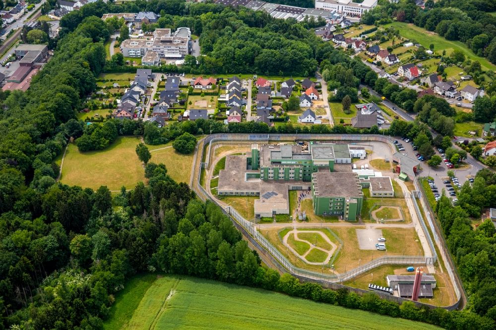 Fröndenberg/Ruhr from the bird's eye view: Prison premises and secure fencing of the JVA - correctional hospital - prison hospital in Froendenberg/Ruhr in the state North Rhine-Westphalia