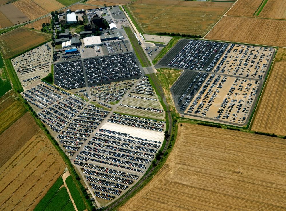 Aerial photograph Zülpich - Compound and parking lots of the car rental company Sixt in the Fuessenich part of Zuelpich in the state of North Rhine-Westphalia. The symmetrical order of the parking lots and rental cars around the buildings and halls are visible in the structures of the surrounding fields and agricultural space