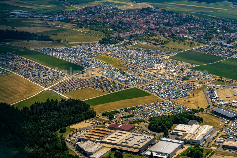 Aerial image Neuhausen ob Eck - Participants in the Southside Music Festival with camping - tents and caravans on the event concert site of the airfield on street Take-Off Gewerbepark in Neuhausen ob Eck in the state Baden-Wuerttemberg, Germany