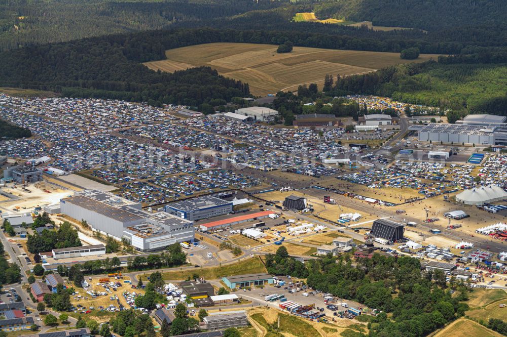 Neuhausen ob Eck from the bird's eye view: Participants in the Southside Music Festival with camping - tents and caravans on the event concert site of the airfield on street Take-Off Gewerbepark in Neuhausen ob Eck in the state Baden-Wuerttemberg, Germany