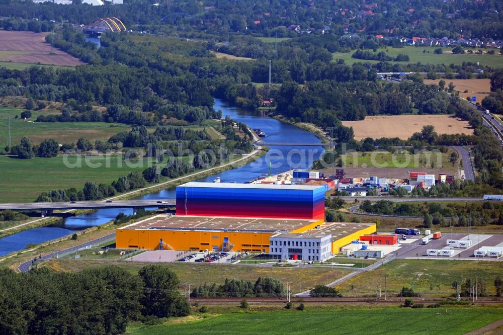 Wustermark from the bird's eye view: High-bay warehouse building complex and logistics center on the premises dm VZ Verteilerzentrum in Wustermark in the state Brandenburg, Germany