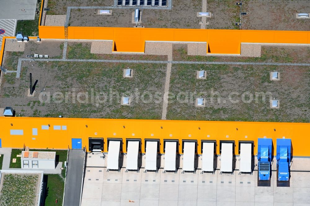 Wustermark from the bird's eye view: High-bay warehouse building complex and logistics center on the premises dm VZ Verteilerzentrum in Wustermark in the state Brandenburg, Germany