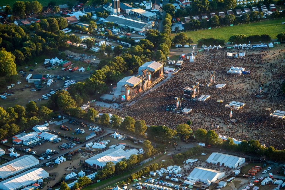 Aerial photograph Wacken - Participants in the Wacken music festival on the event concert area on street Norderstrasse in Wacken in the state Schleswig-Holstein, Germany