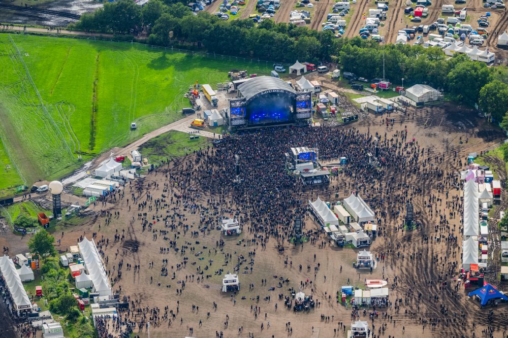 Aerial photograph Wacken - Participants in the Wacken music festival on the event concert area in Wacken in the state Schleswig-Holstein, Germany