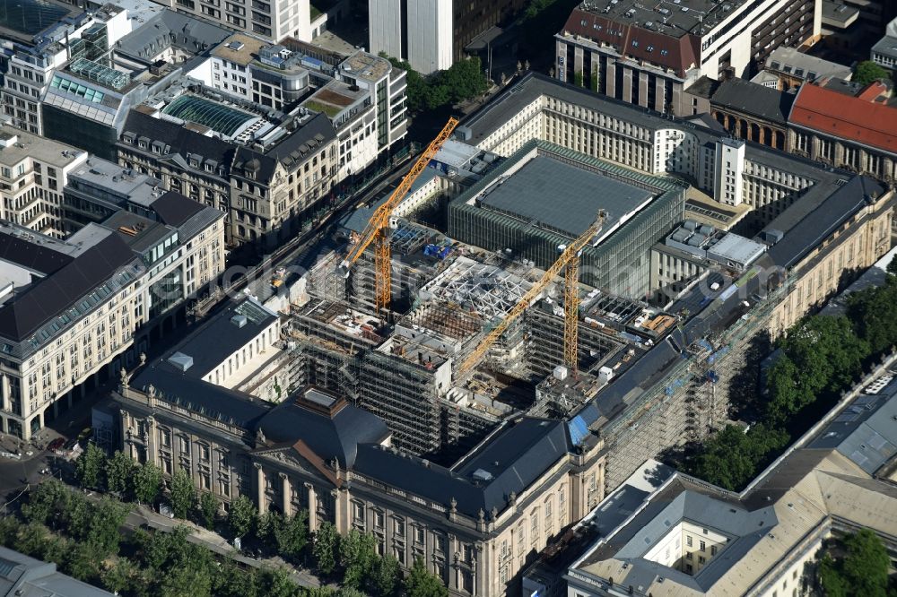 Aerial photograph Berlin - Overhaul and modernization of the State Library of Berlin Unter den Linden in the district Mitte in Berlin. Currently in the first phase arises a new reading roomas a glass cube, a rare book reading room, a safe magazine for the special collections also incurred is the north old building which will be completely renovated. In the second phase then will arise a Freehand magazin, a treasury, a library museum, an exhibition area, a catering facility and the northern part of the old building will be completely renovated. The activities are carried out by the architect and museum designer HG Merz, builder is the covenant