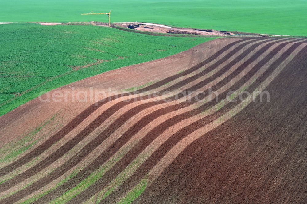 Wettin-Löbejün from the bird's eye view: Plowed fields in rows on the waves of a hilly landscape in Wettin-Loebejuen in the state Saxony-Anhalt, Germany