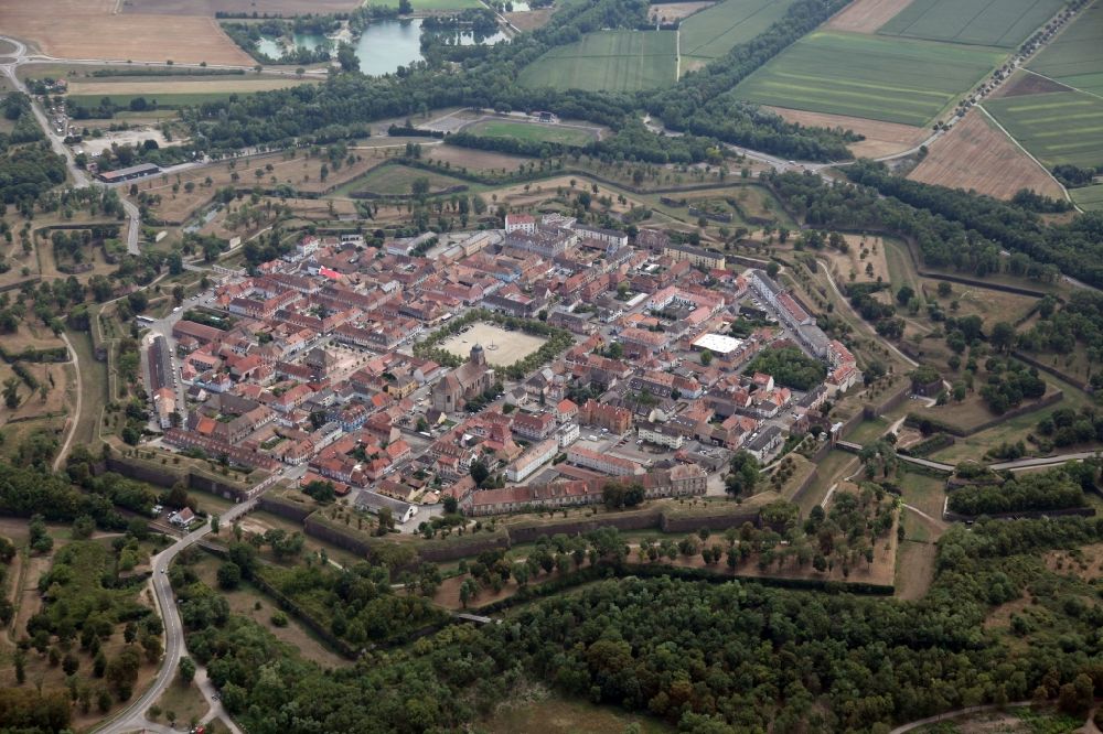 Aerial photograph Neuf-Brisach - General view of the city and fortress Neuf-Brisach in France. The city was built by the military architect Prestre de Vauban together with his architect Jacques Tarade. They designed the city plan in the form of an octagon with a central parade ground and a chessboard-like road network as an ideal form of a fortress town