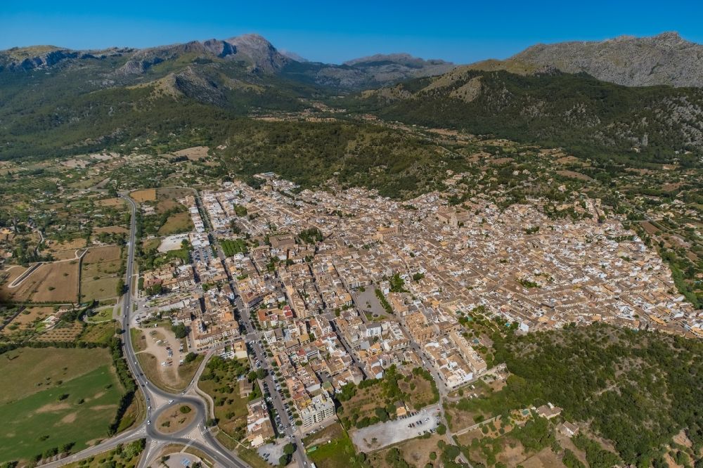 Pollenca from above - City area with outside districts and inner city area in Pollenca in Balearische Insel Mallorca, Spain