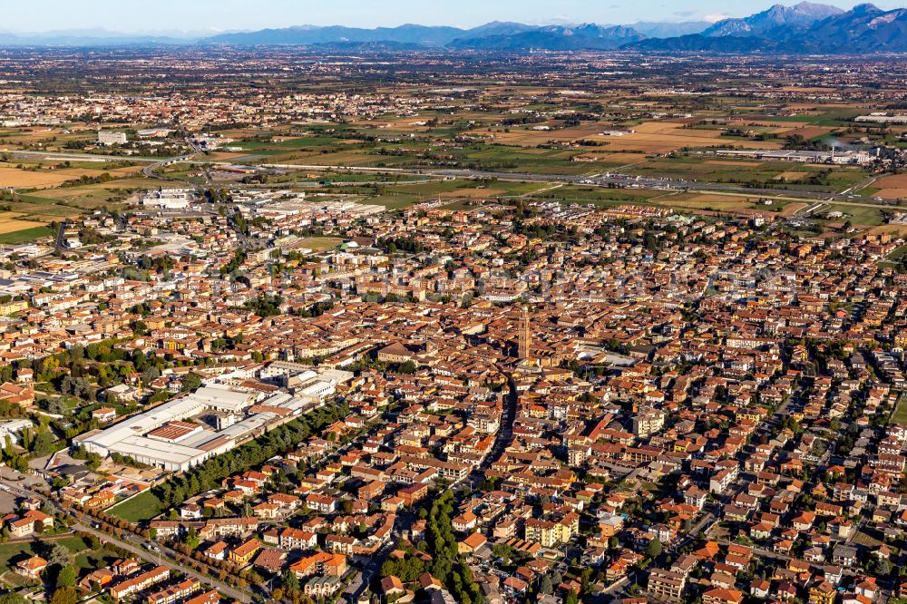 Aerial image Caravaggio - City area with outside districts and inner city area in Caravaggio in the Lombardy, Italy