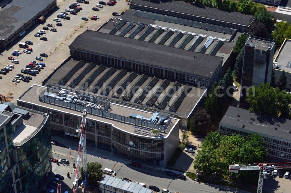 Aerial image Warschau - Office building of Eniro in the Mokotow district of Warsaw in Poland. Eniro is a marketing company, which operates in Poland under the name Panorama Firm and runs a local search website and directory as well as mobile apps. The office building is located next to storage halls and an industrial site in Mokotow