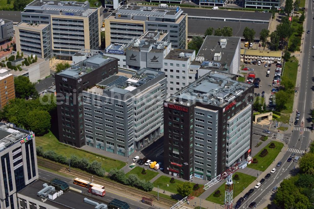 Aerial photograph Warschau - Business District on Marynarska Street in the Mokotow District in Warsaw in Poland. There are several business and office buildings located on the street. The toy company Toys R Us and its polish headquarters are located there. Opposite it, there are offices of the General Insurance Company, DNB Bank and the conference center Adgar Plaza