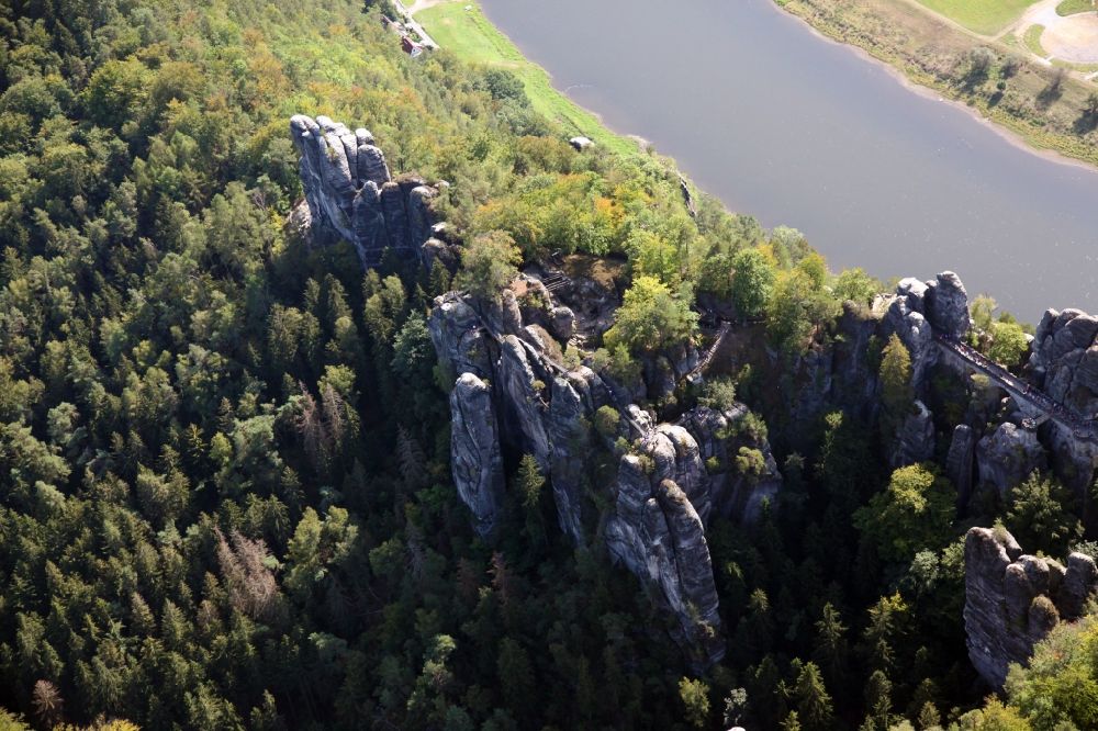 Lohmen from above - Rock massif and rock formation Ferdinandstein on Basteiweg in Lohmen in the state Saxony, Germany
