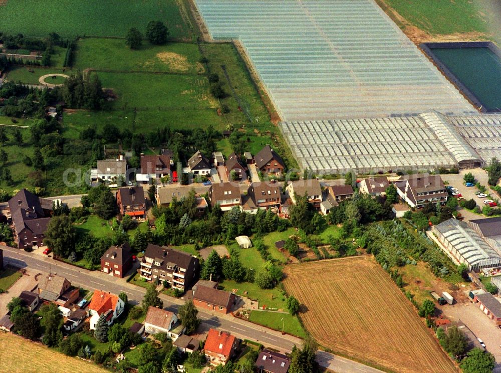 Aerial image Rheinberg - Glass roof surfaces in the greenhouse rows for Floriculture in the district Eversael in Rheinberg in the state North Rhine-Westphalia