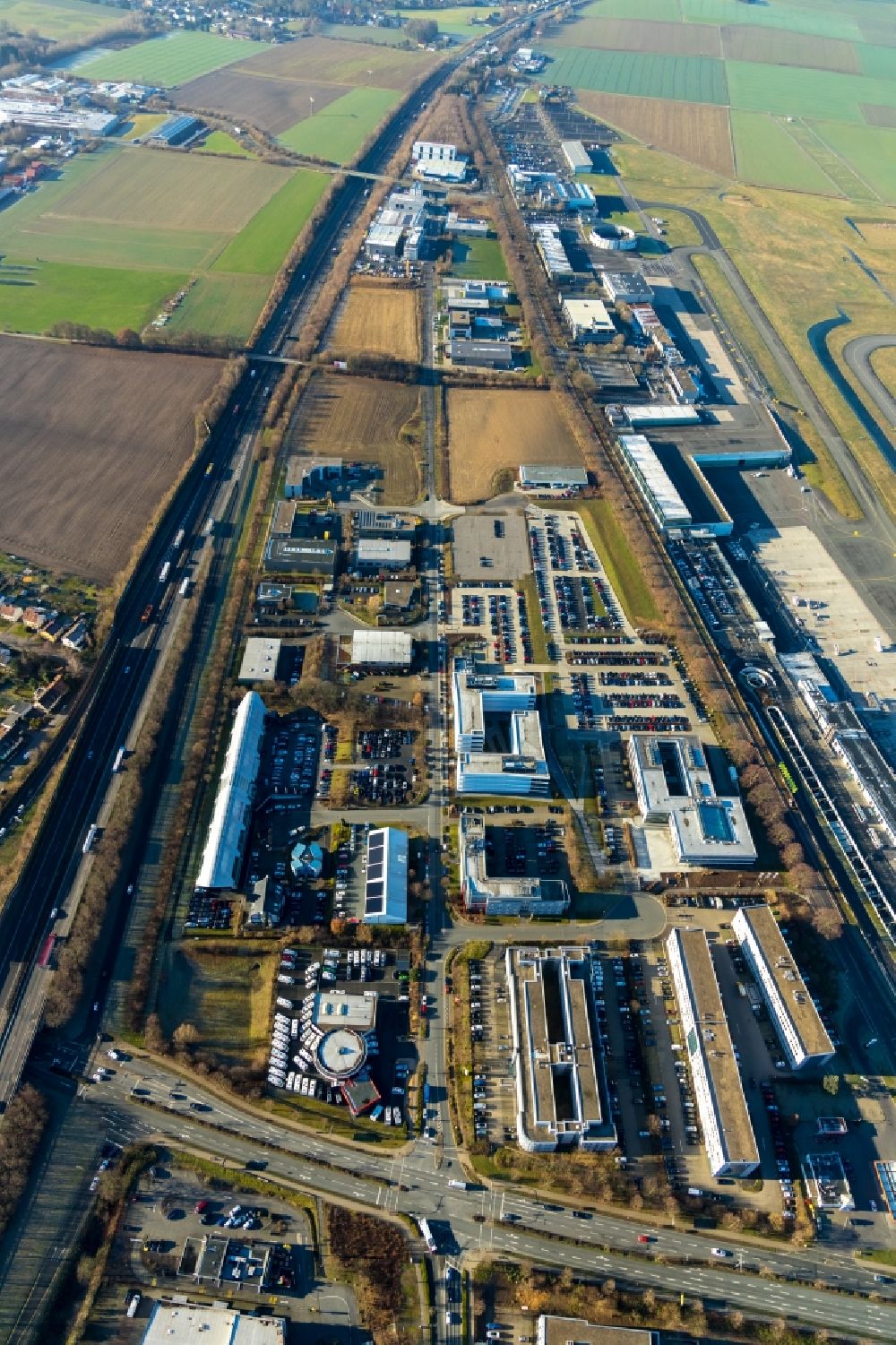 Holzwickede from the bird's eye view: Industrial estate and company settlement overlooking the airport in the district Brackel in Holzwickede in the state North Rhine-Westphalia, Germany