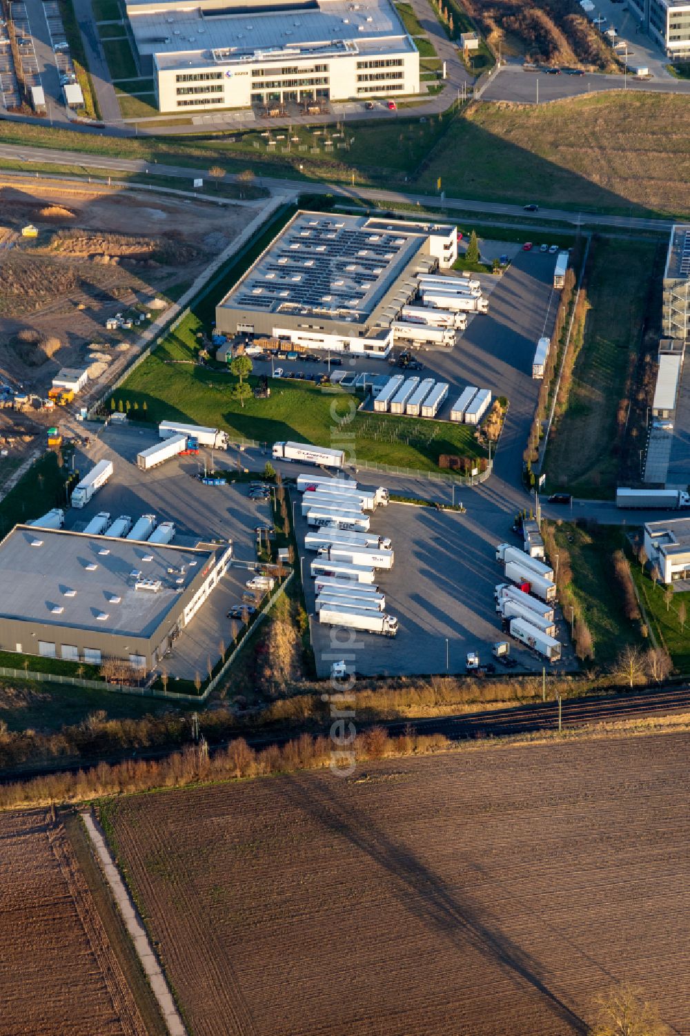 Aerial photograph Rülzheim - Industrial estate and company settlement with TOP LINE Logistics GmbH & Co. KG TRANSAC Intern. Speditionsgesellschaft mbH in the Carl-Benz-Strasse in Ruelzheim in the state Rhineland-Palatinate, Germany