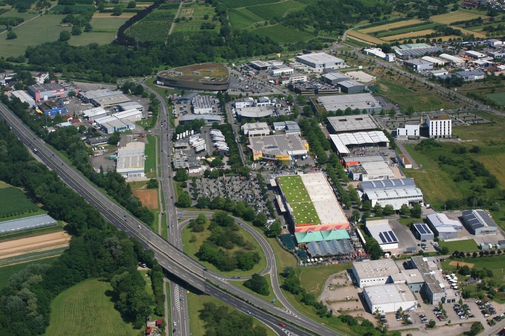 Binzen from the bird's eye view: Industrial estate and company settlement Dreispitz at the motorway A98 in Binzen in the state Baden-Wurttemberg