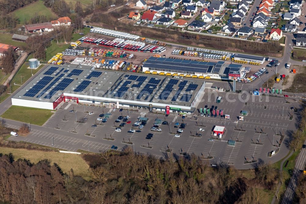 Rohrbach from the bird's eye view: Industrial estate and company settlement Sued with Engel & Engel GmbH DHL-Paket-Transporter-Verwertungm, Suedpfalz Center, Wasgau Frischemarkt Rohrbach and MODEPARK ROeTHER in Rohrbach in the state Rhineland-Palatinate, Germany