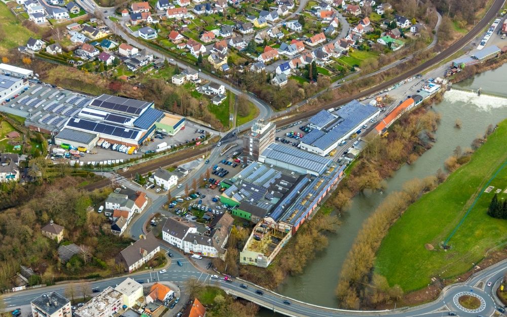 Aerial image Fröndenberg/Ruhr - Industrial estate and company settlement along the Ruhr with a dam and a bridge structure at Unnaer Strasse / Ardeyer Strasse in the district Langschede in Froendenberg/Ruhr in the state North Rhine-Westphalia, Germany