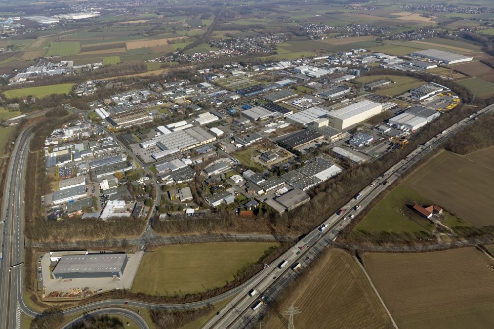 Unna from the bird's eye view: Commercial area of the industrial park at the Unna Unna-Ost motorway exit the motorway A44 in North Rhine-Westphalia