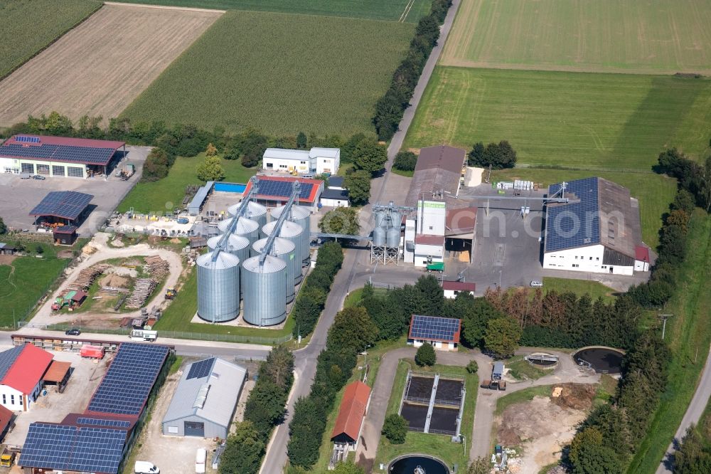 Holzheim from the bird's eye view: Industrial estate and company settlement on Raiffeisenstrasse in Holzheim in the state Bavaria, Germany